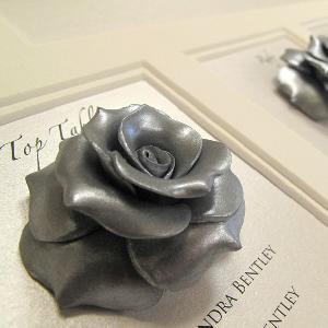 A breathtaking Multi Aperture couture table plan using silver handmade roses  a show stopping table plan