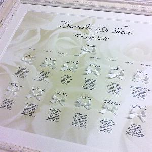A Guild Bow Printed and Embellished Table Plan with Pretty Ivory Hand Tied Satin Ribbon Bows