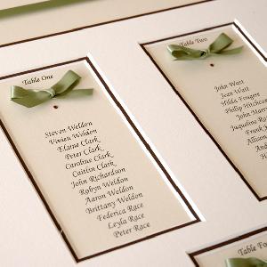 Using coordinating ribbon draws the theme of the wedding together with the table plan
